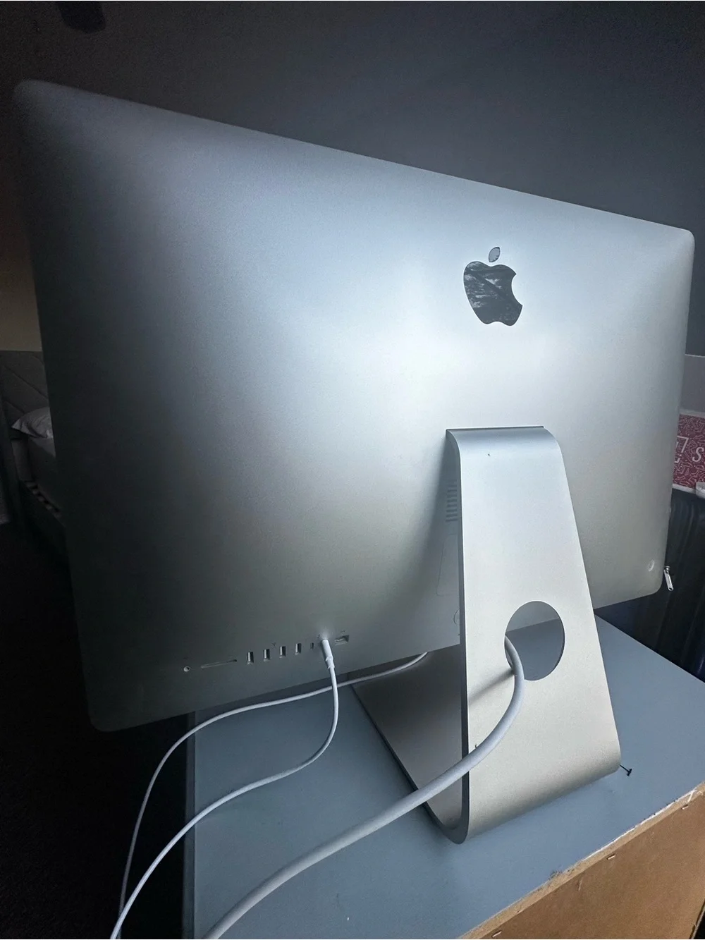 Apple iMac with Orange and Red Display, Silver Body.